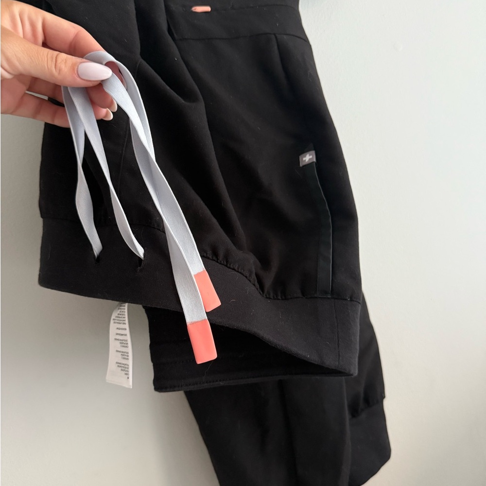 Figs Black pants  with Gray and Pink Accents